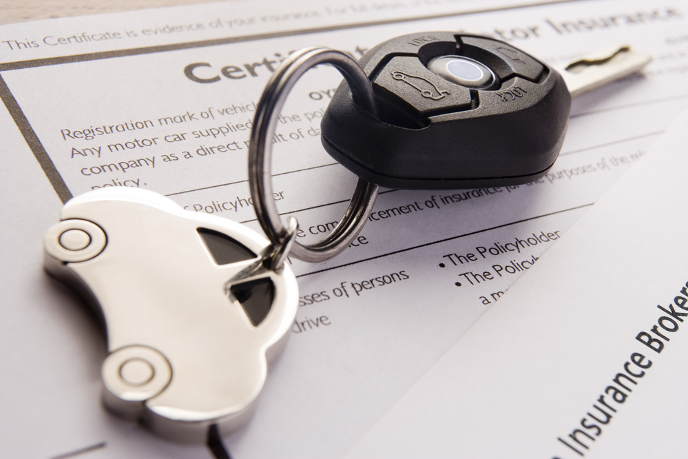 Car Keys on Insurance Documents
